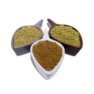 Three bowls of different kratom powders arranged in leaf-shaped dishes, showcasing various color and textures of the kratom. The image highlights the rich diversity, enhancing flavor and aroma.