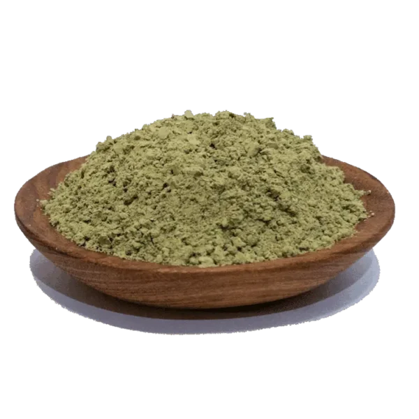 Green powder in a wooden bowl, commonly used as a natural supplement for health benefits, showcasing its fine texture and vibrant color