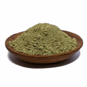 Green herbal powder in a wooden bowl, commonly used for natural remedies and supplements, highlighting its fine texture and vibrant color
