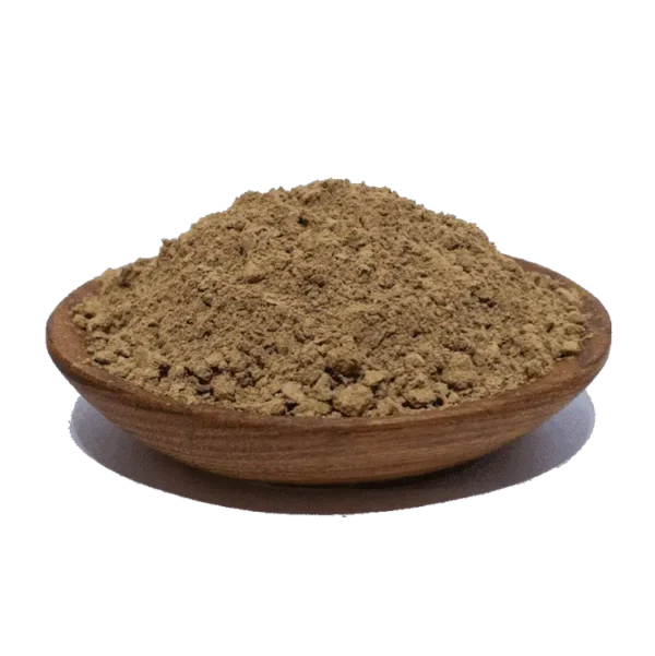 Mound of herbal powder in a wooden bowl, showcasing its fine texture and earthy color