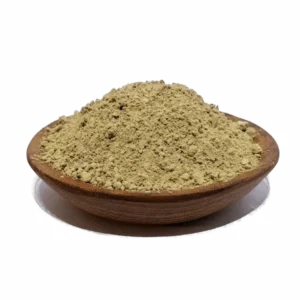 Close-up of a wooden bowl filled with fine yellow herbal powder, often used as a natural remedy or dietary supplement, highlighting its texture and color for health and wellness applications